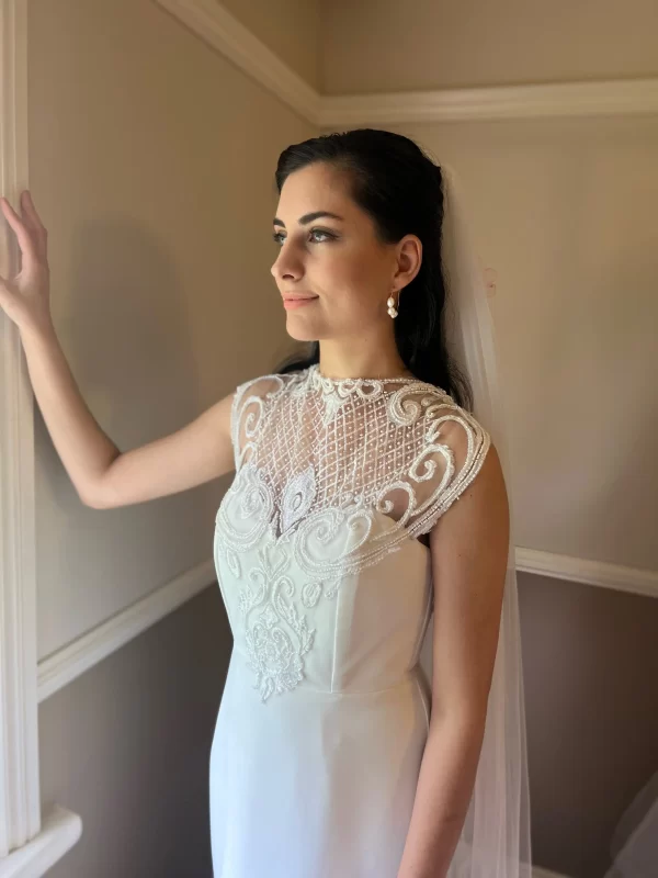 Sophia Pearl Earrings being modeled by a bride looking out of a window