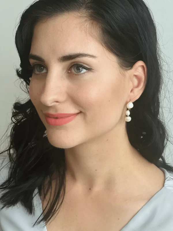 Arianna earrings with silver plating being modeled on a bride wearing relaxed bridal wear
