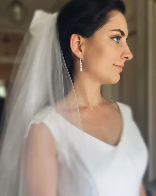 Lydia Pearl Earrings being modeled by a bride